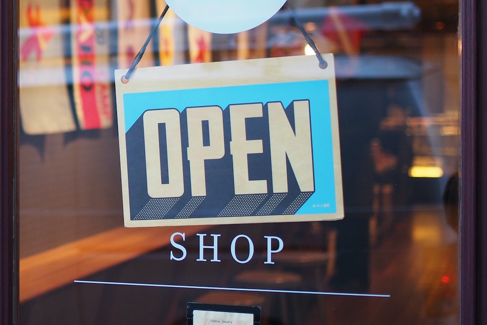 Blog header image showing an open sign on a store for the article on the Sage 100cloud Marketplace - SWK Technologies