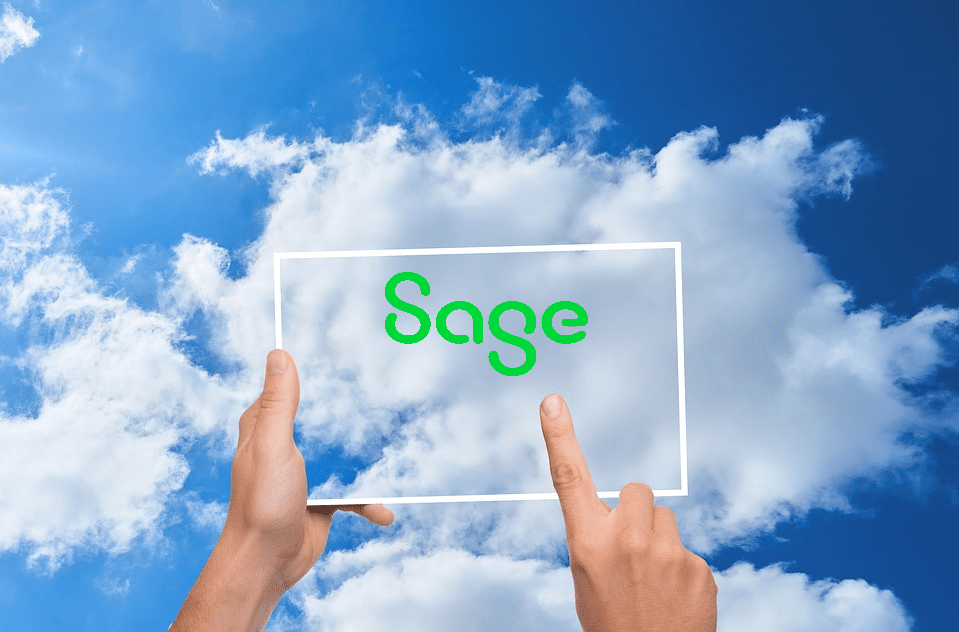 Hands holding transparent frame with Sage logo against blue sky with white clouds, representing Sage ERP cloud hosting services