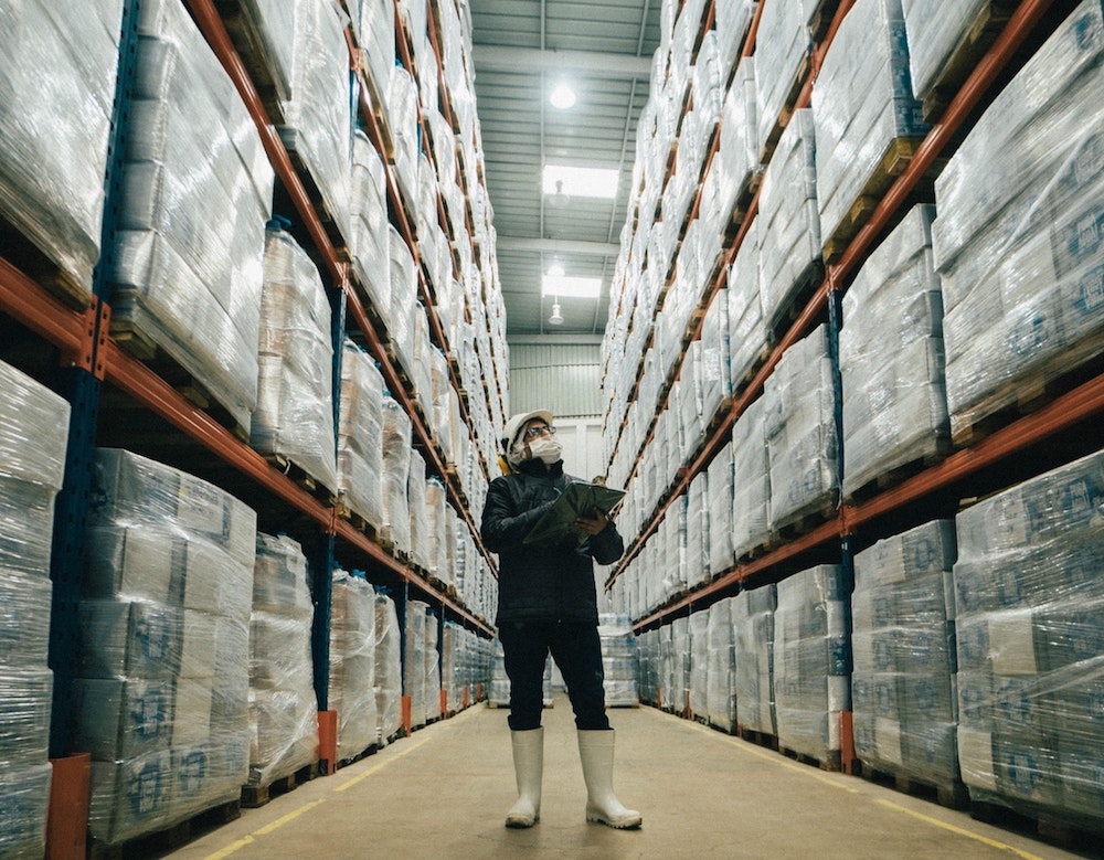 Header image of a person in a warehouse for blog post about Implementing ERP for your distribution company by SWK Tech