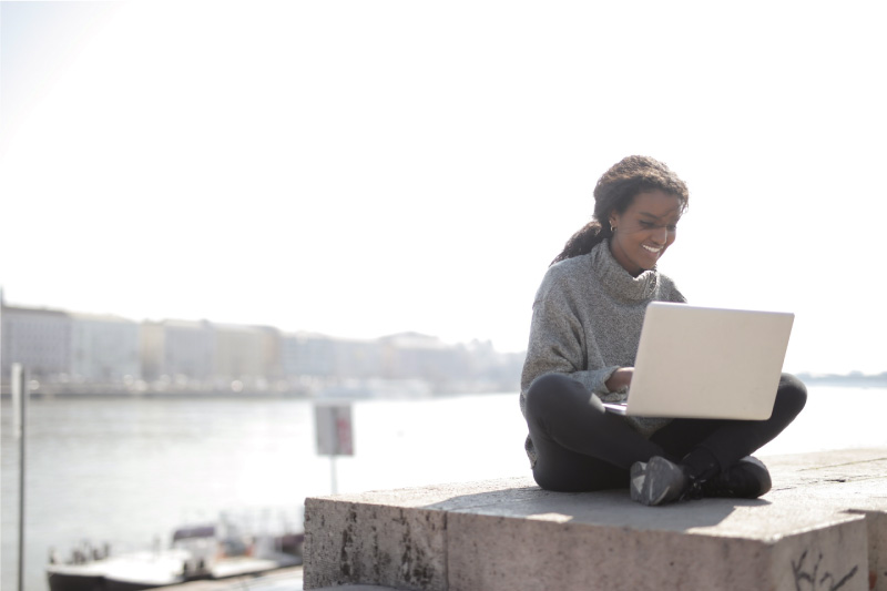 double blockchain data archival solution remote worker on laptop outside