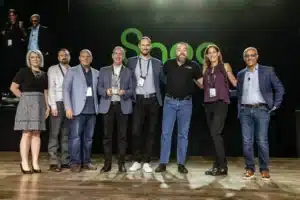 A group of people posing for a picture on stage.