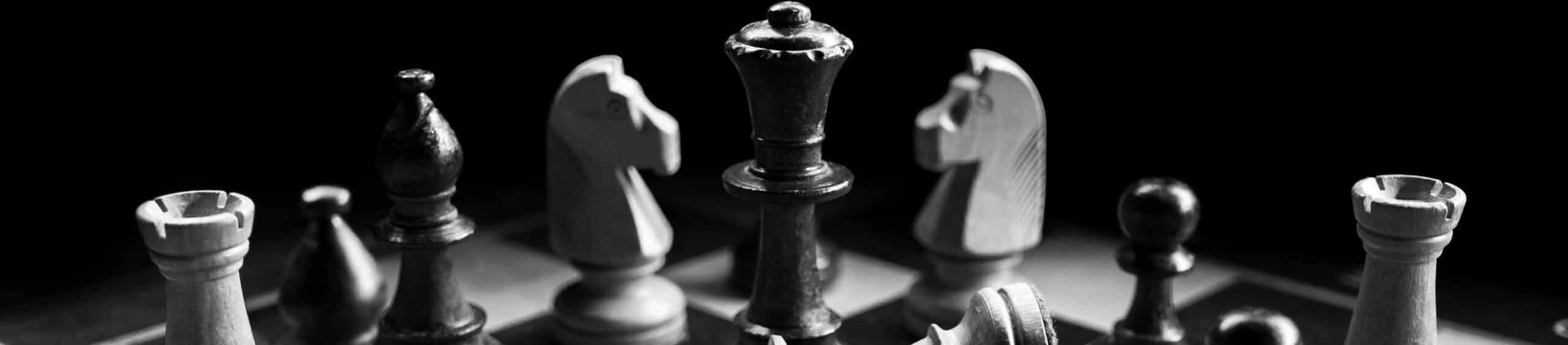 A black and white photo of a chess set.