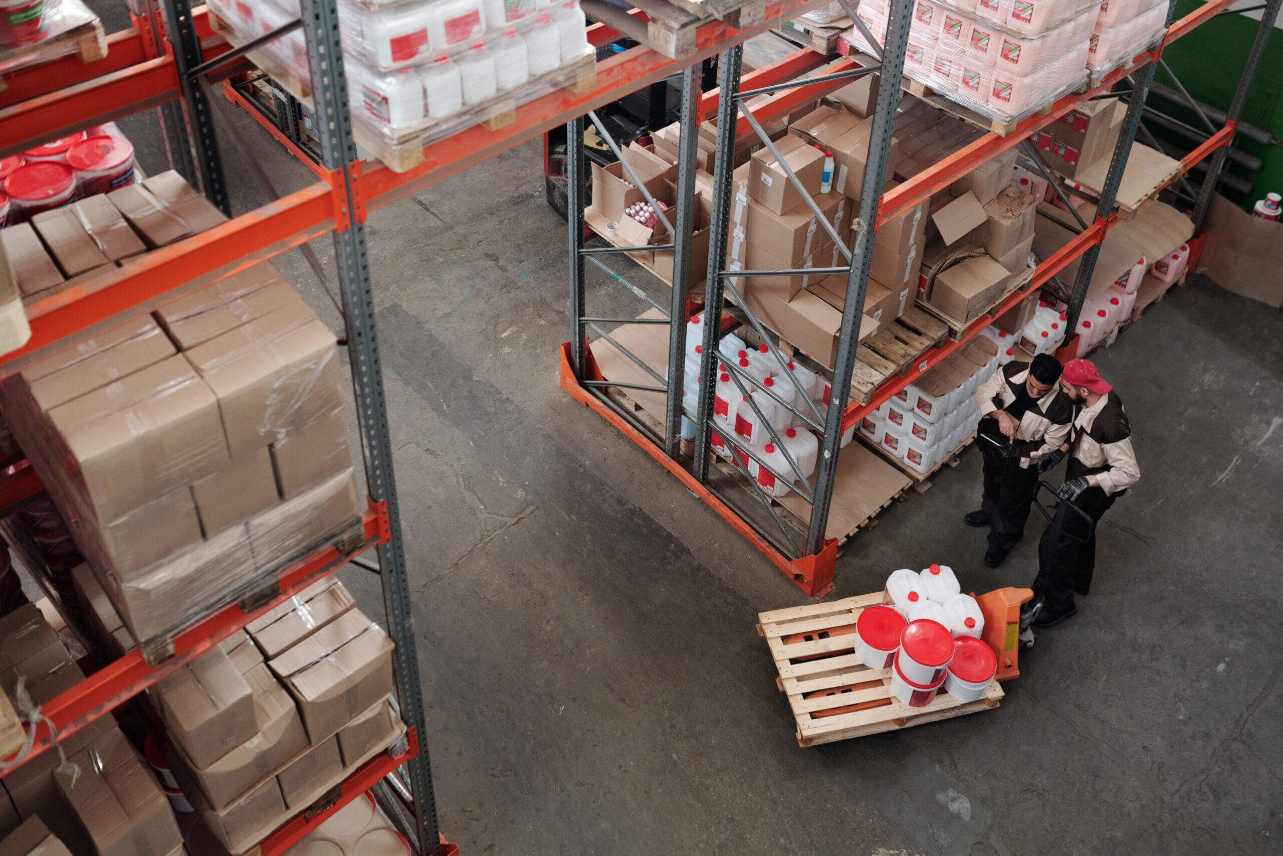 Two people working in a warehouse.