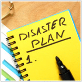 A yellow notebook with the word disaster plan on it.