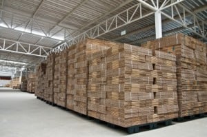 A warehouse full of pallets of wood.