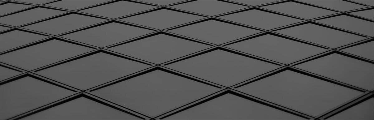 A close up image of a black glass wall.