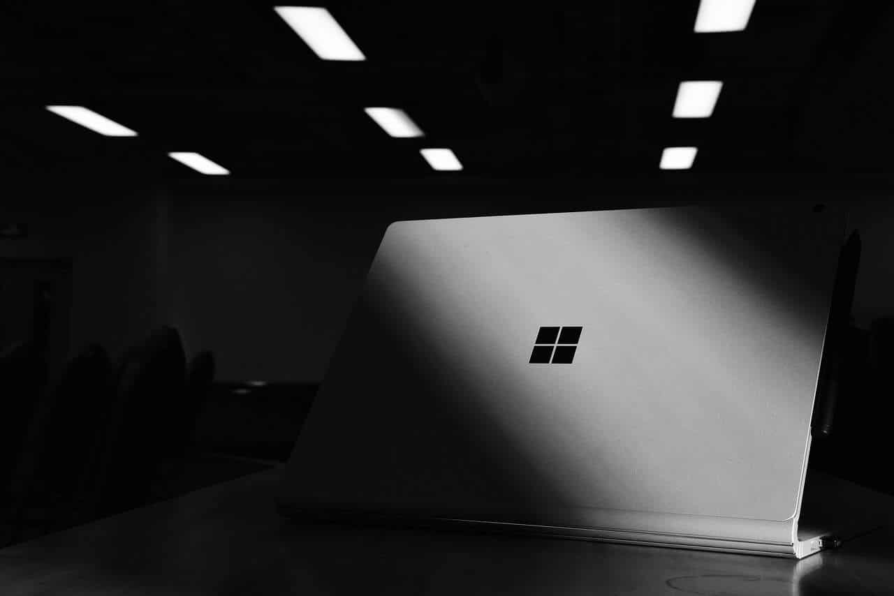 A black and white photo of a Microsoft surface laptop.