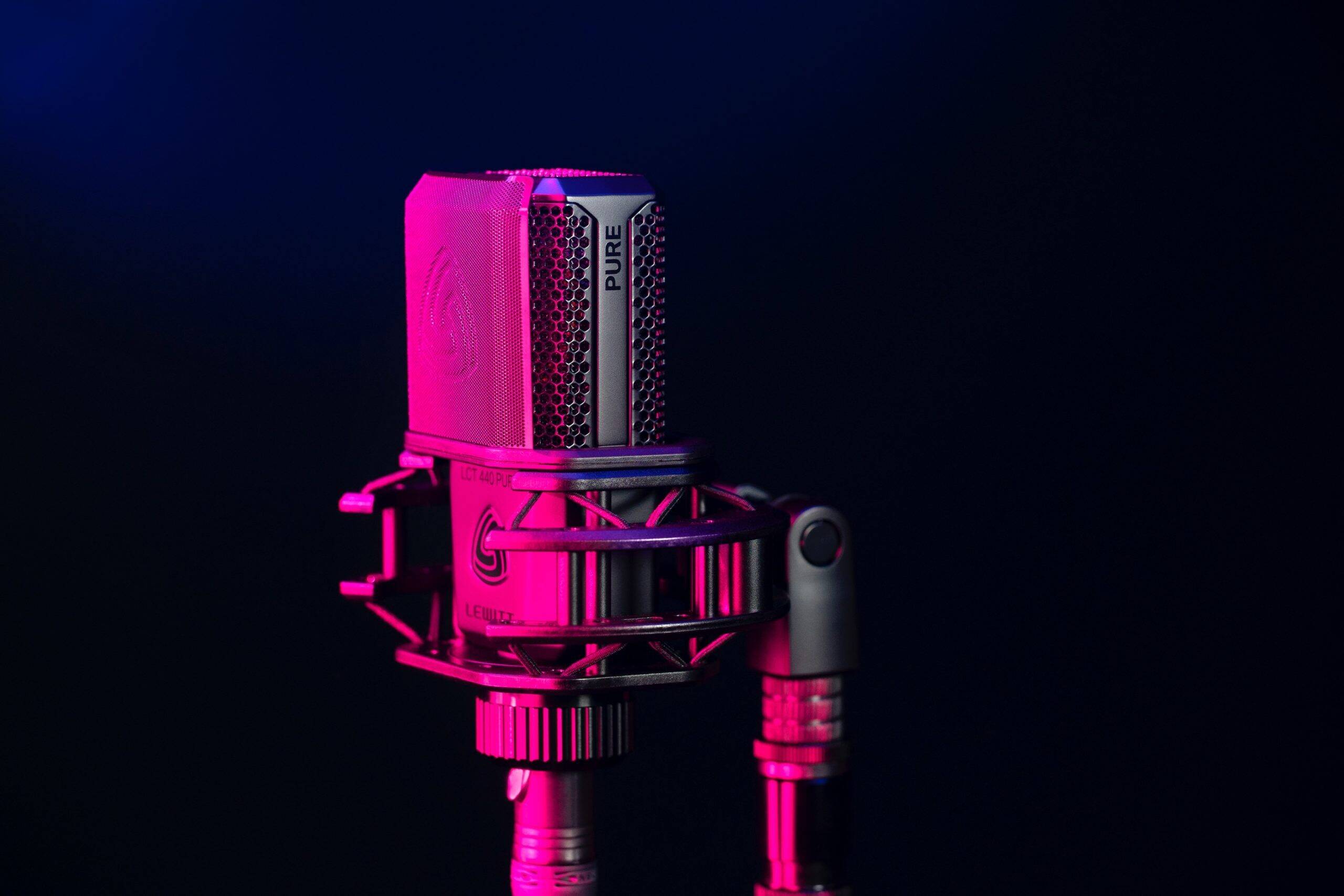 A microphone in front of a dark background.