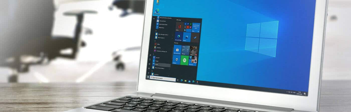 A laptop with windows 10 on it sitting on a table.