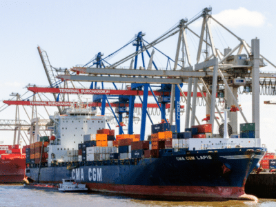 A container ship docked in a harbor.