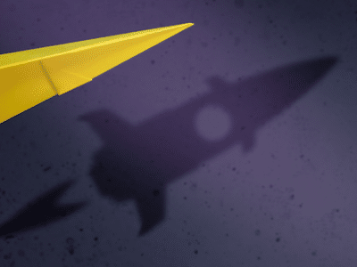 A shadow of a yellow paper airplane on a dark background.