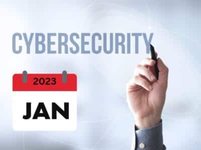 A person writing the word cyber security on a calendar in january.