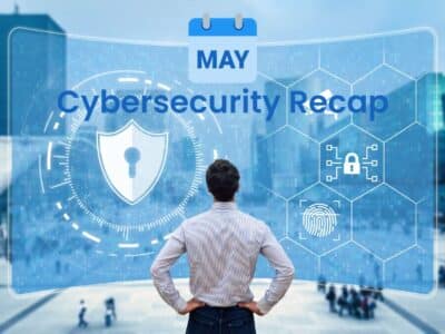 A man looking at a screen with the words: May Cybersecurity Recap.