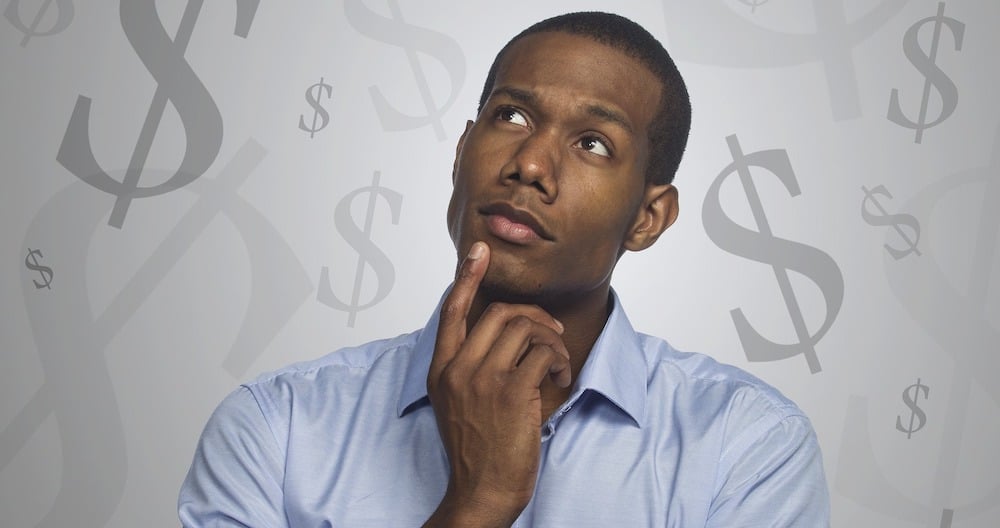 Blog header image of a man thinking about payroll taxes for the Everything You Need to Know About Sage 100 Payroll 2.21.1 article from the ERP experts at SWK Technologies