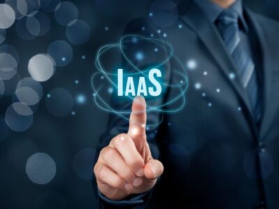 A businessman is pointing at the word IaaS.