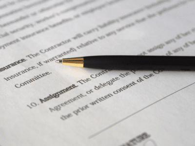 A pen sits on top of a document.