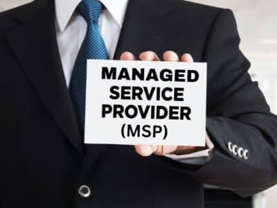 A man holding up a sign that says managed service provider msp.