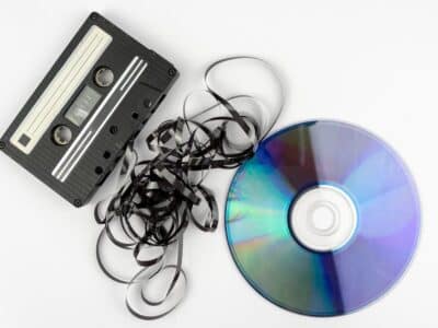 A cassette and a cd on a white background.