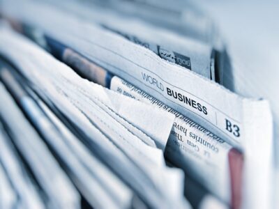 A close up of newspapers in a folder.