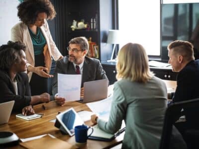 A group of business people having a meeting in a conference room.