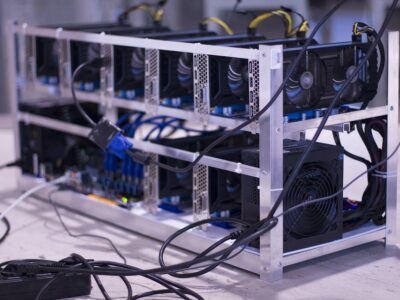 A rack of bitcoin mining equipment sitting on a table.