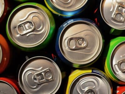 A close up of several cans of soda.