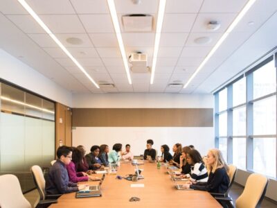 A group of people sitting around a conference table.