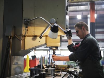 A man working on a machine in a factory.