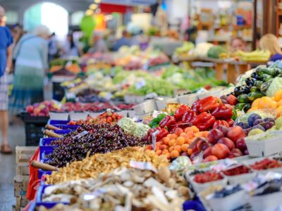 A market with a lot of fruit and vegetables.