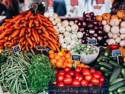 A variety of vegetables are on display at a market.