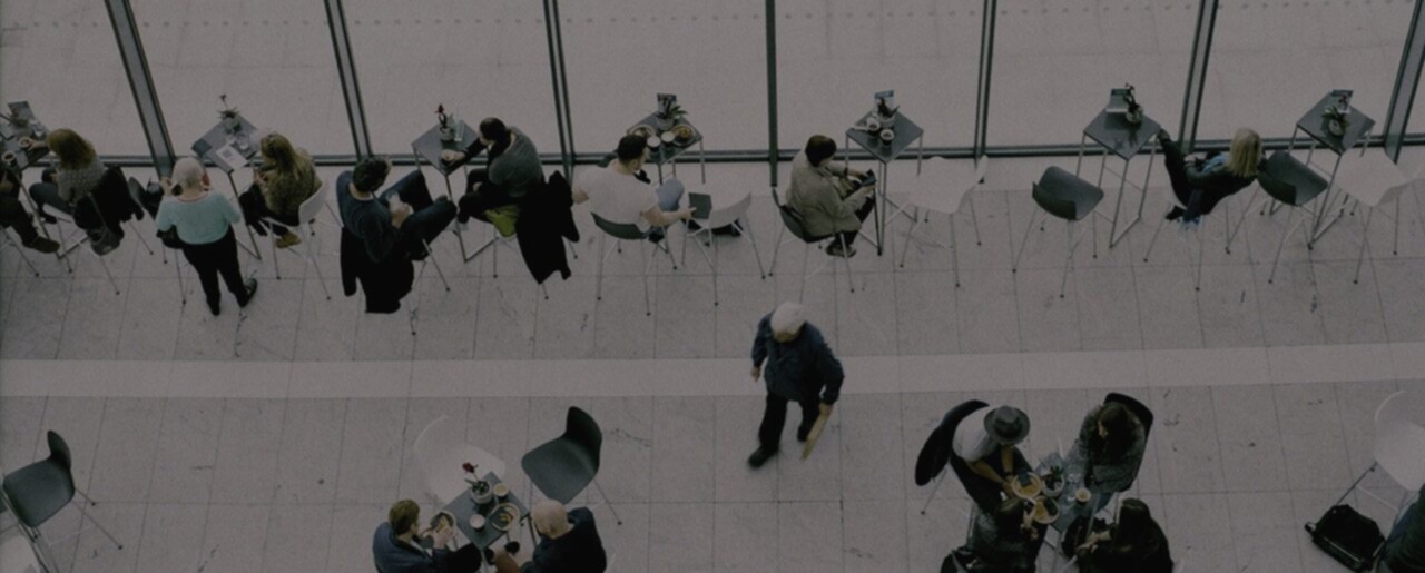 A group of people standing in a conference room.