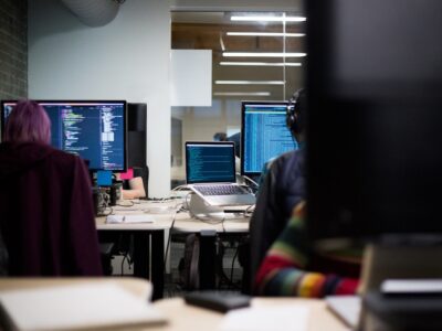 A group of people working on computers in an office.