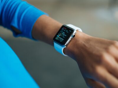 A woman's wrist with a smart watch on it.