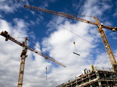 Construction cranes on a construction site.