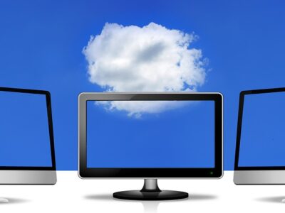 Three monitors with a cloud in the background.