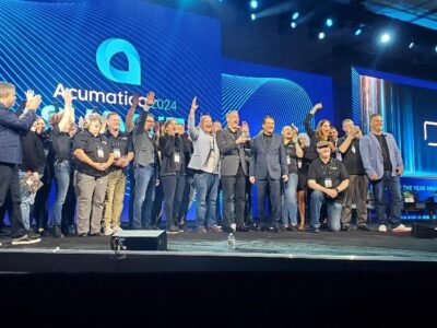 A picture of SWK executives and employees accepting the Acumatica Partner of the Year Award at Acumatica Summit 2024