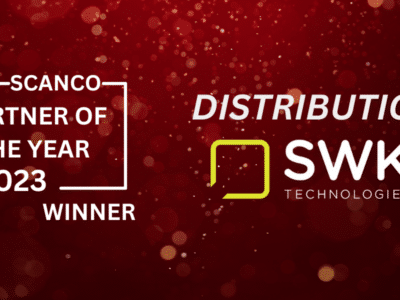 White lettering saying Scanco Partner of the Year 2023 Winner in Distribution is SWK Technologies