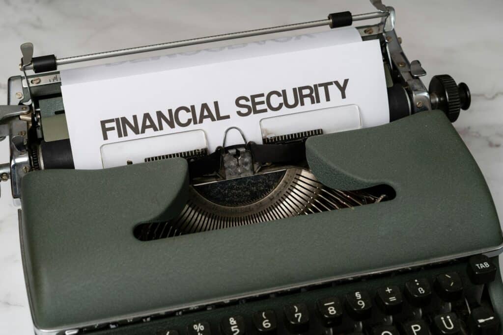 Vintage typewriter with paper displaying "FINANCIAL SECURITY" in typed text, symbolizing accounting data protection and cybersecurity concerns.