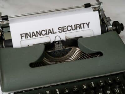 Vintage typewriter with paper displaying "FINANCIAL SECURITY" in typed text, symbolizing accounting data protection and cybersecurity concerns.