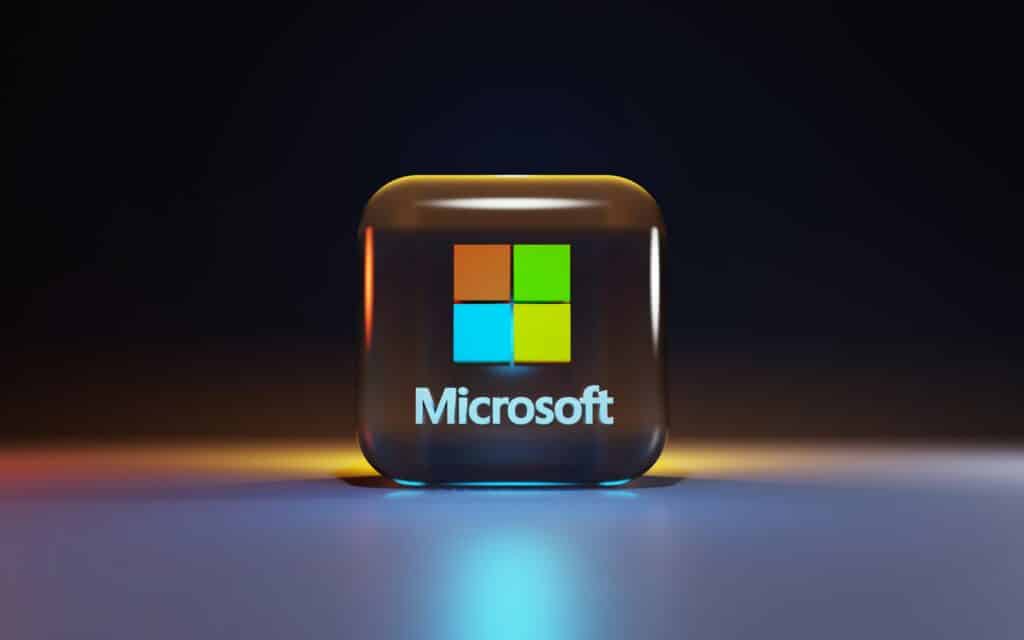 Microsoft 365 logo icon displayed on a dark background with glowing light effects, representing Microsoft 365 Business and Enterprise plan pricing changes effective July 2026.