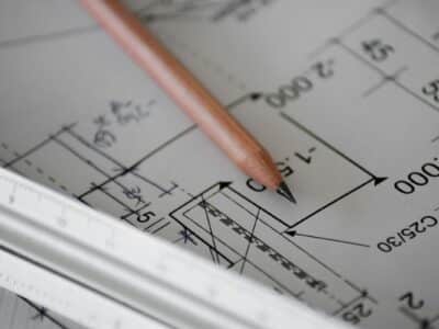 Commercial construction blueprint with pencil and ruler showing project plans and measurements