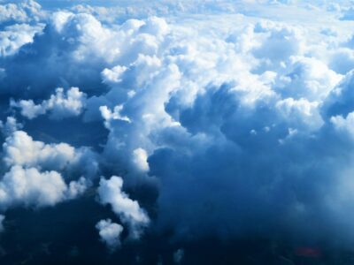 Blue and white clouds representing public and private cloud hosting infrastructure options for businesses in 2026