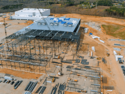Data center under construction with long-lead equipment and committed cost planning