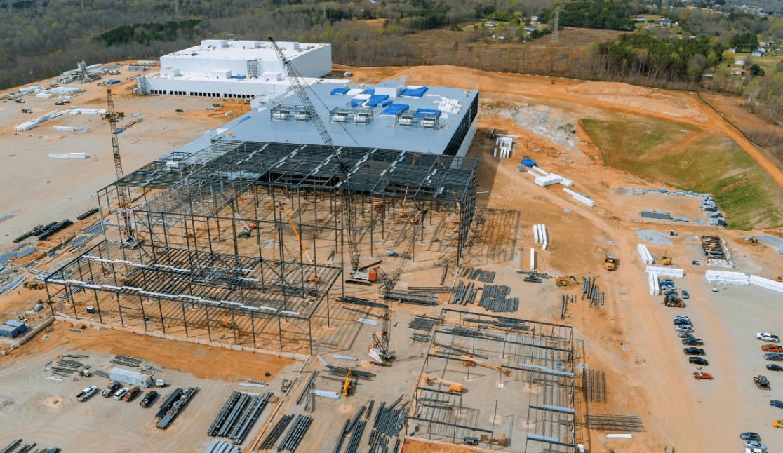 Data center under construction with long-lead equipment and committed cost planning