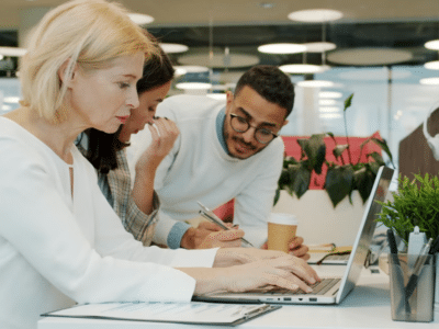 Finance team reviewing Sage Intacct 2026 R2 updates in a business meeting