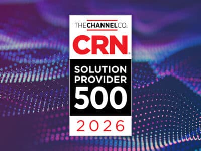 CRN 2026 Solution Provider 500 award badge from The Channel Company on a purple and blue digital wave background.