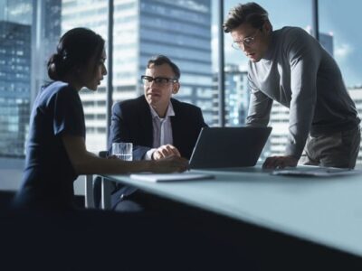 Executives reviewing real-time portfolio margin data on a digital dashboard